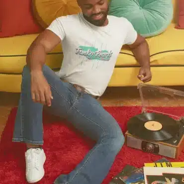 T shirt man listening to a record with a 70 s