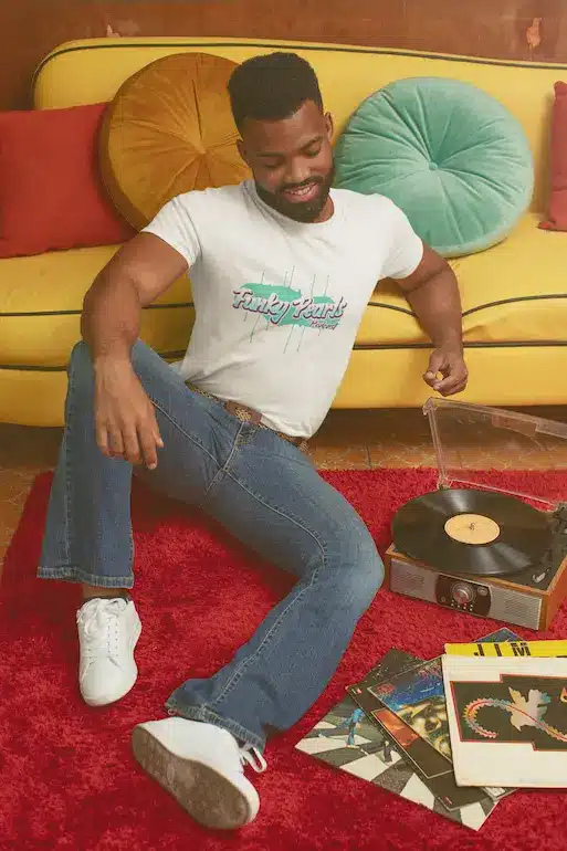 T shirt man listening to a record with a 70 s